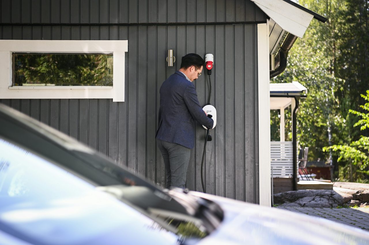 An electric car charging at home